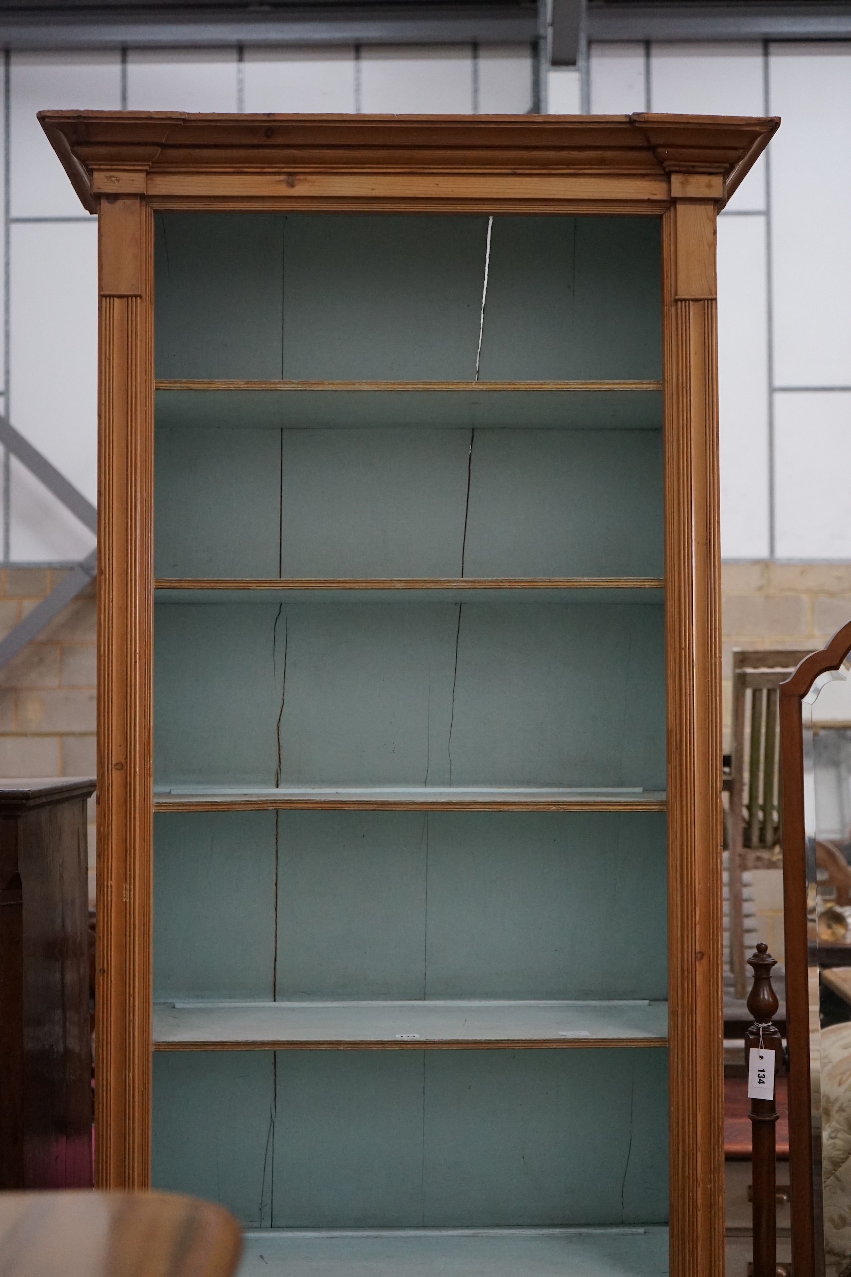 A Victorian pitch pine tall open bookcase, width 90cm, depth 44cm, height 231cm